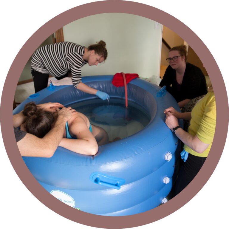 Pregnant woman practicing HypnoBirthing techniques in birthing pool.